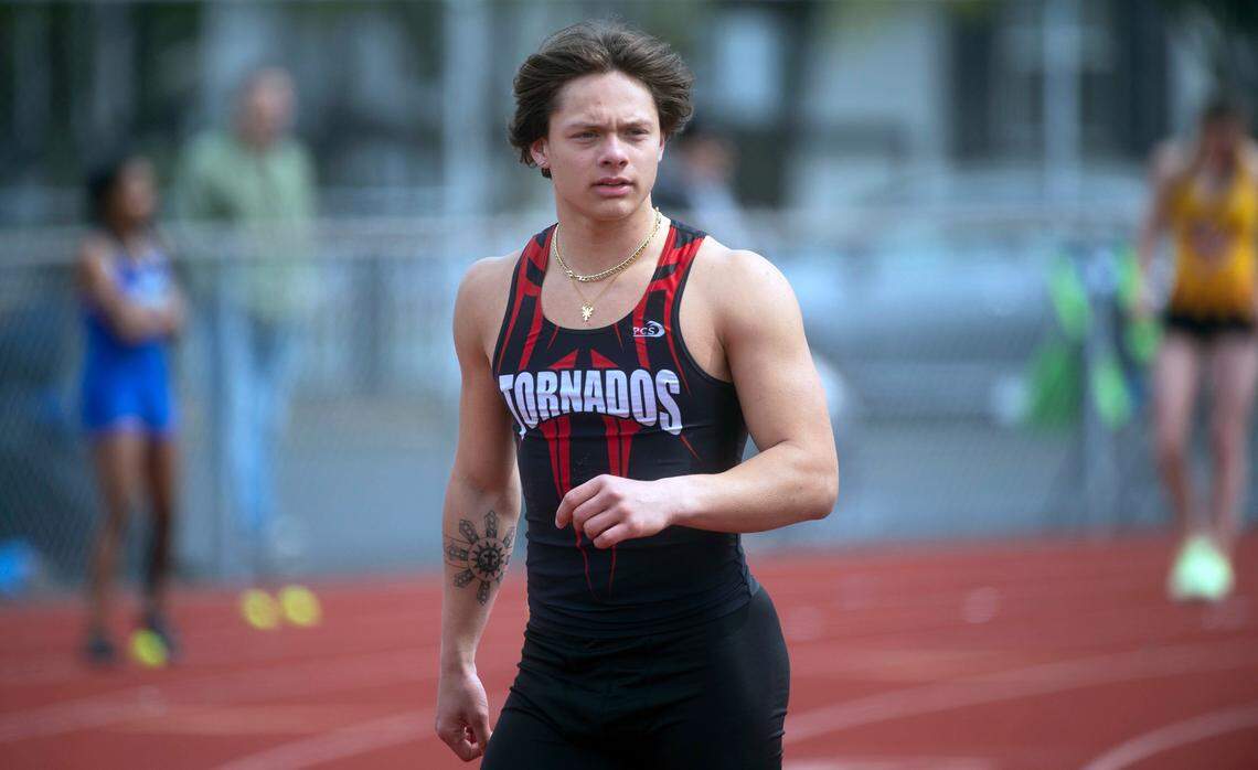 Yelm’s multi-sport athlete Kyler Ronquillo moves between pole vault and long jump competitions during the South Sound Track & Field Classic at Sparks Stadium in Puyallup. Washington, on Saturday, April 16, 2022.