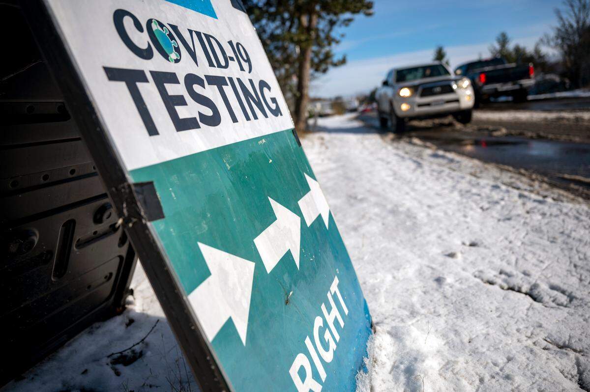 People line up in their vehicles at a COVID-19 testing site run by Pierce County on 3003 107th Street South in Lakewood on Monday afternoon.