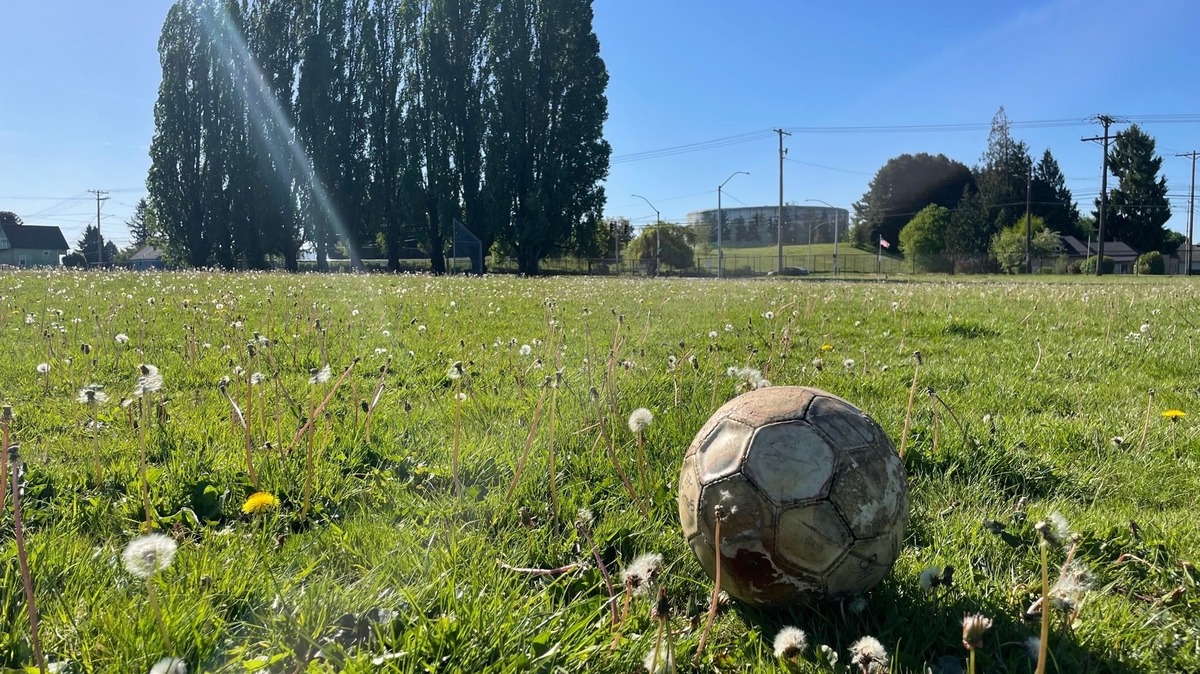 An old soccer ball photographed at the playfields behind Stanley Elementary on Hilltop on May 13, 2023.