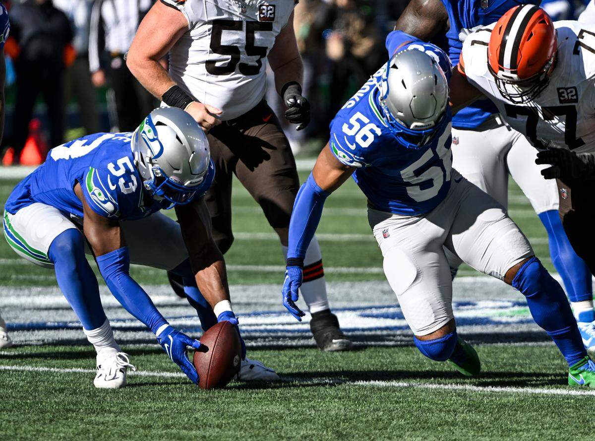 Seattle Seahawks linebacker Boye Mafe (53) scopes up Cleveland Browns’ fumbled ball during the first quarter of the game at Lumen Field, Sunday, Oct. 29, 2023, in Seattle, Wash.