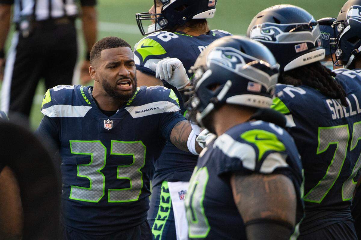 Seattle Seahawks safety Jamal Adams (33) gets the defense hyped while injured on the sideline during the fourth quarter. The Seattle Seahawks played the Dallas Cowboys in a NFL football game at CenturyLink Field in Seattle, Wash., on Sunday, Sept. 27, 2020.