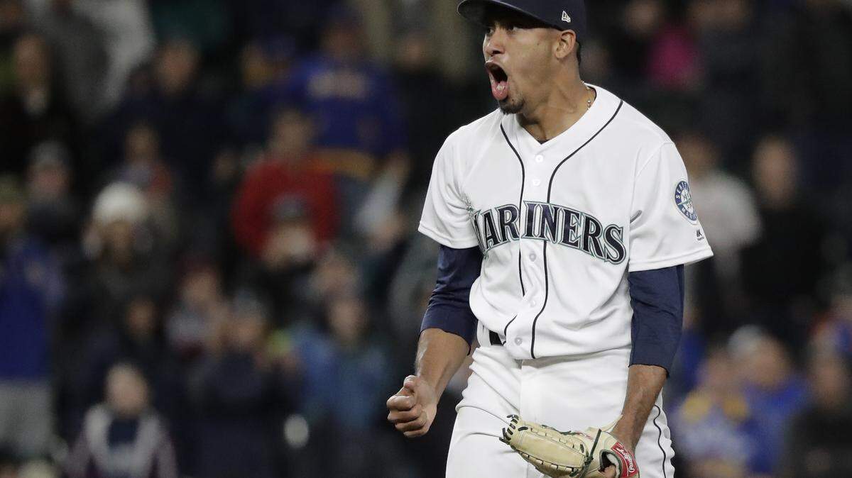 Seattle Mariners closing pitcher Edwin Diaz reacts after he struck out Houston Astros' Marwin Gonzalez in the ninth inning to end the baseball game, Monday, April 16, 2018, in Seattle. The Mariners won 2-1. (AP Photo/Ted S. Warren)