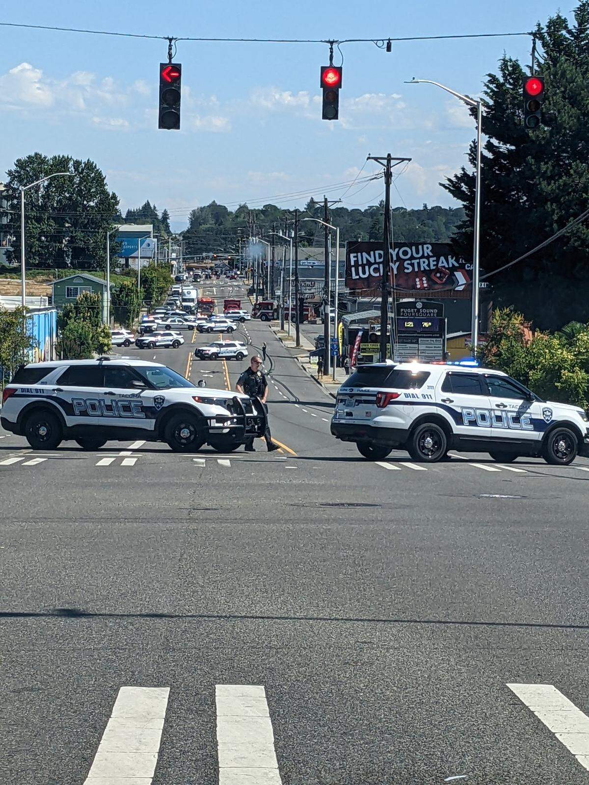 About a quarter-mile of South 56th Street was shut down Tuesday afternoon while police responded to a report of a suicidal person. Tacoma police said at least 20 officers were called to the scene.