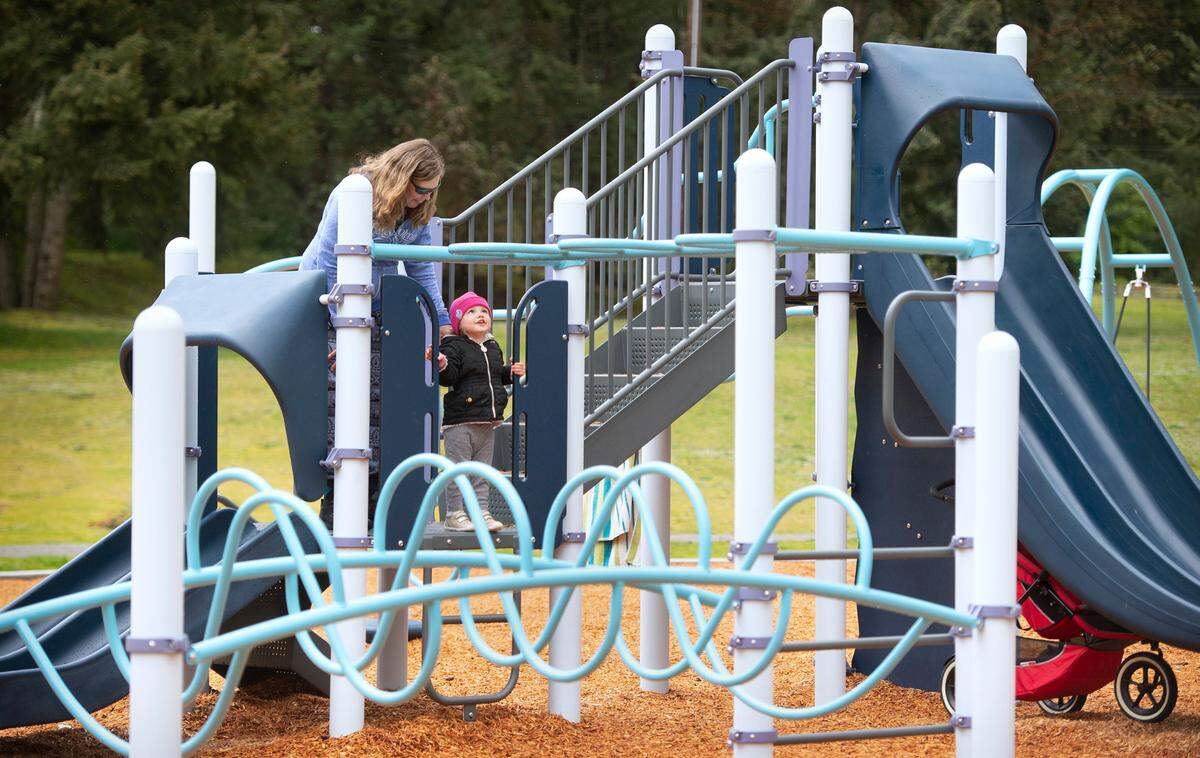 Shari Shelton of Waller plays with her granddaughter, Raeyah, on the new jungle gym equipment at the Lidford Playfield in Waller, Washington, on Tuesday, April 26, 2022.