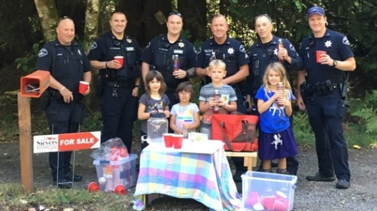 Pierce County Sheriff’s deputies pose with the lemonade gang.
