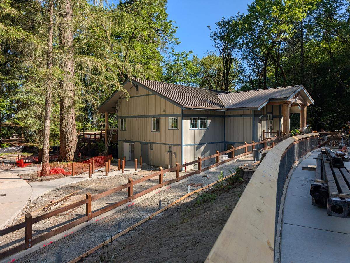 Construction workers build the community center at Kopachuck State Park on May 8, 2025. The park has been closed for a year during a $10 million renovation project. Officials expect to reopen it in August.