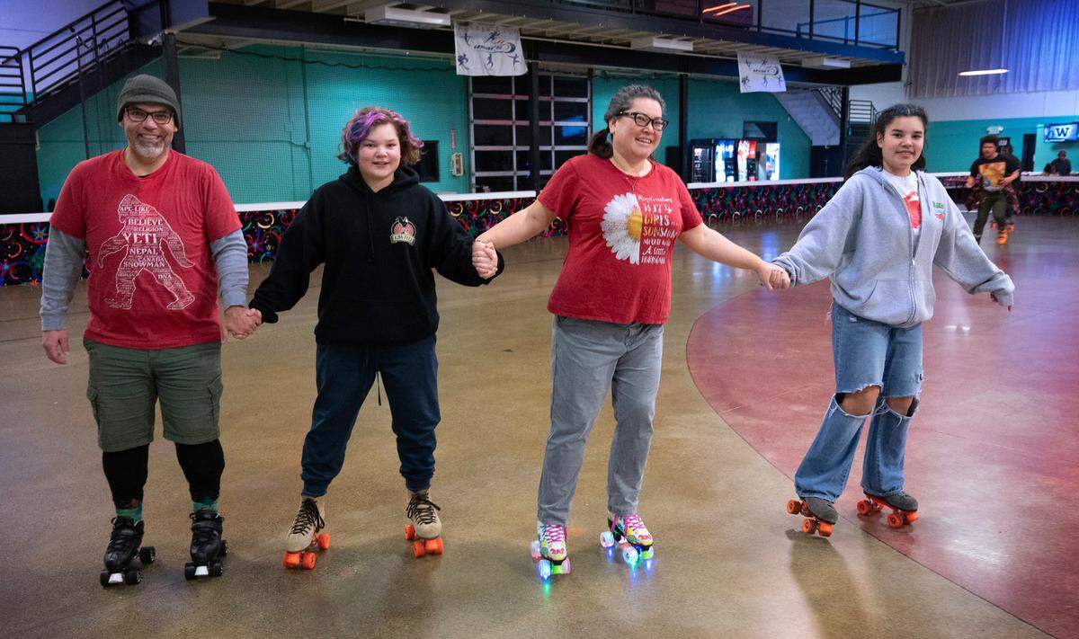 The Manweiler family of Maple Valley traveled at least twice a week to skate at Skateworld Tacoma in Fircrest, Washington, shown here on Friday, Jan. 19, 2024. From left are Joel, Alexander, 11, Tanya and Annabelle, 13. The roller skating venue closed March 31, 2024.