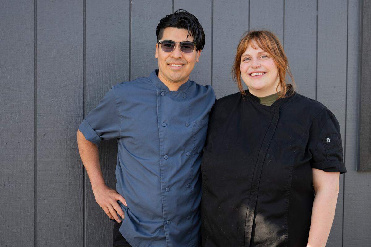 Lobo Bakery owners Keely and Miguel Silva-Glenn pose for a portrait at My Commercial Kitchen, where they bake off hundreds of croissants every week for farmers markets in Proctor, Puyallup, Lakewood and Maple Valley.