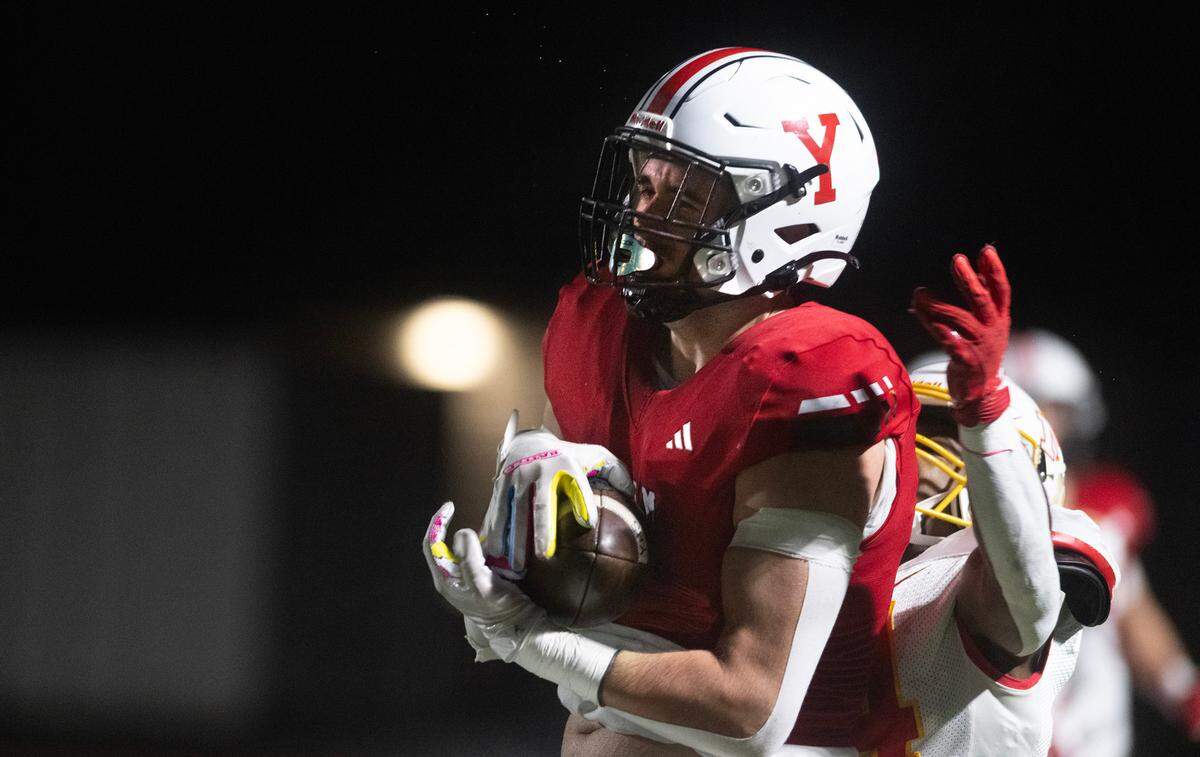 Yelm wide receiver Jacob Tracy pulls in a pass over Mount Tahoma cornerback Brison Bailey during Friday night’s 3A state quarterfinal football game at Yelm High School in Yelm, Washington, on Nov. 17, 2023. Yelm won the game, 29-12.