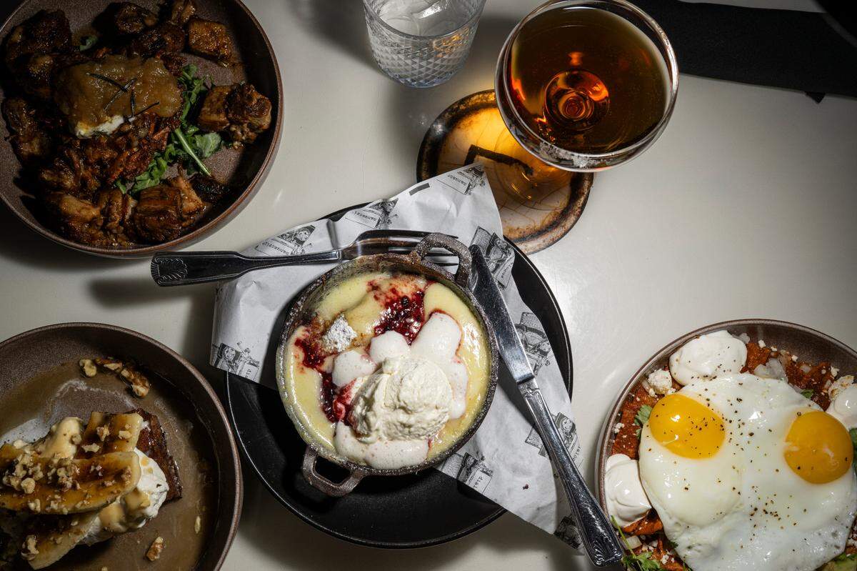 Manuscript has served brunch in the Stadium District since opening in February 2024. Clockwise from top: The Manifest espresso martini served up, Tio’s Chilaquiles, Lemongrab Dutch baby, deep-fried banana bread pudding and pork belly hash.