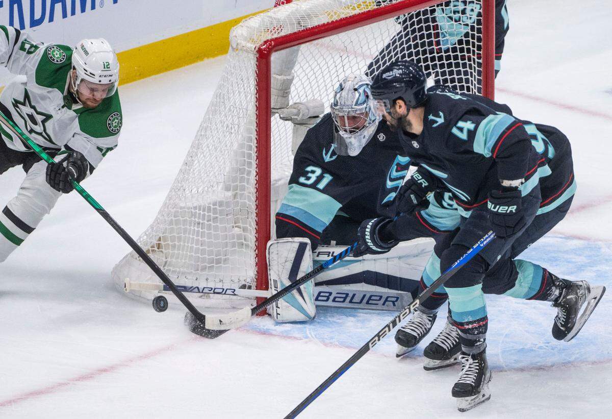 Dallas Stars center Radek Faksa (12) tries to score as Seattle Kraken goaltender Philipp Grubauer (31) defends the goal during the first period of game four of the second round of the 2023 Stanley Cup Playoffs in Seattle, Wash. on May 9, 2023.