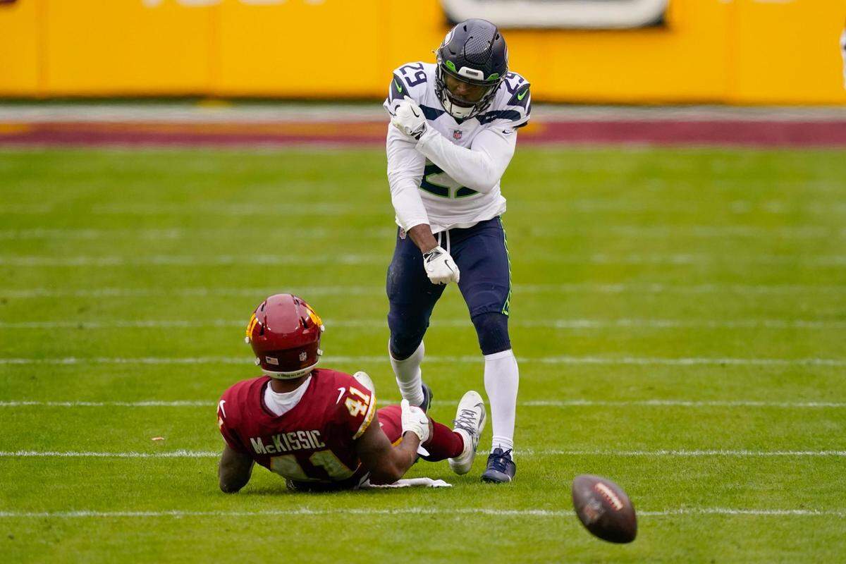 Seattle Seahawks free safety D.J. Reed (29) reacting after stopping Washington Football Team running back J.D. McKissic (41) from catching the ball during the first half of an NFL football game, Sunday, Dec. 20, 2020, in Landover, Md. (AP Photo/Andrew Harnik)
