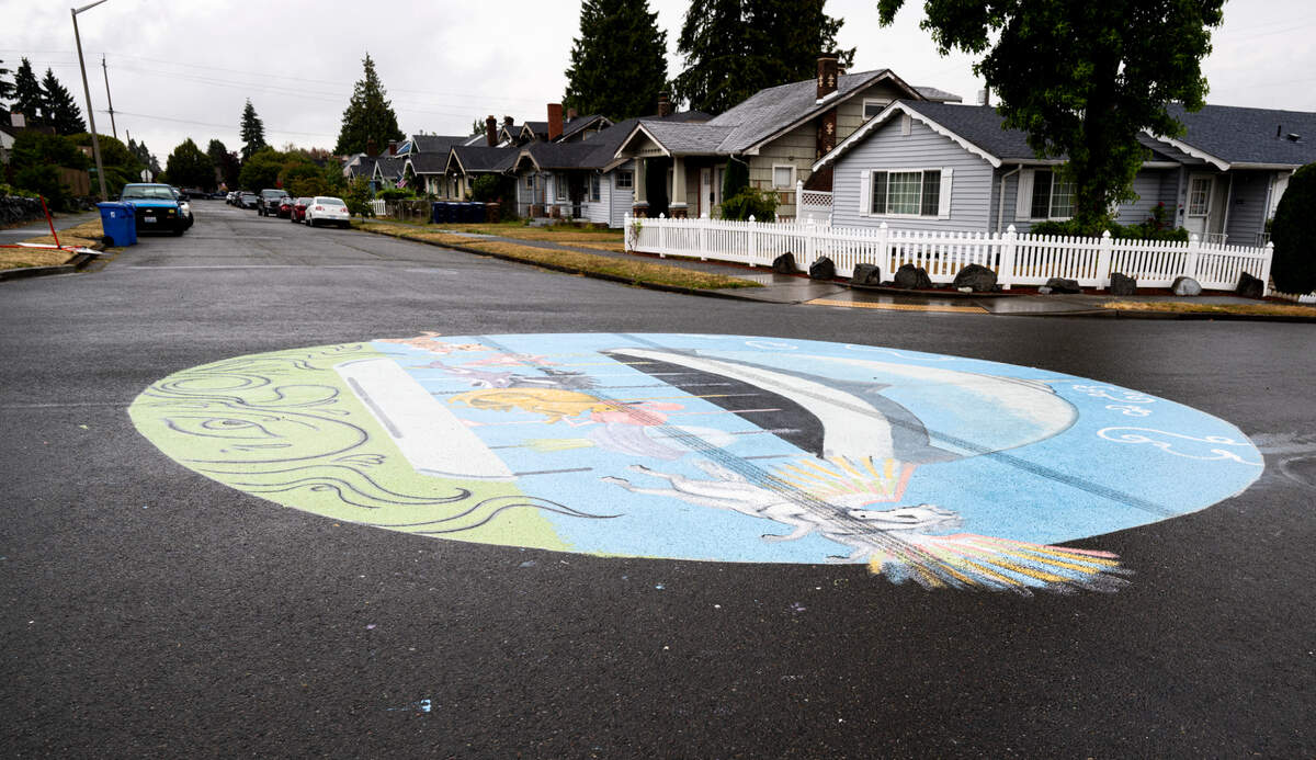 Tire tracks mark a mural in the intersection of South 50th Street and South D Street, on Tuesday, Aug. 20, 2024, in Tacoma, Wash.