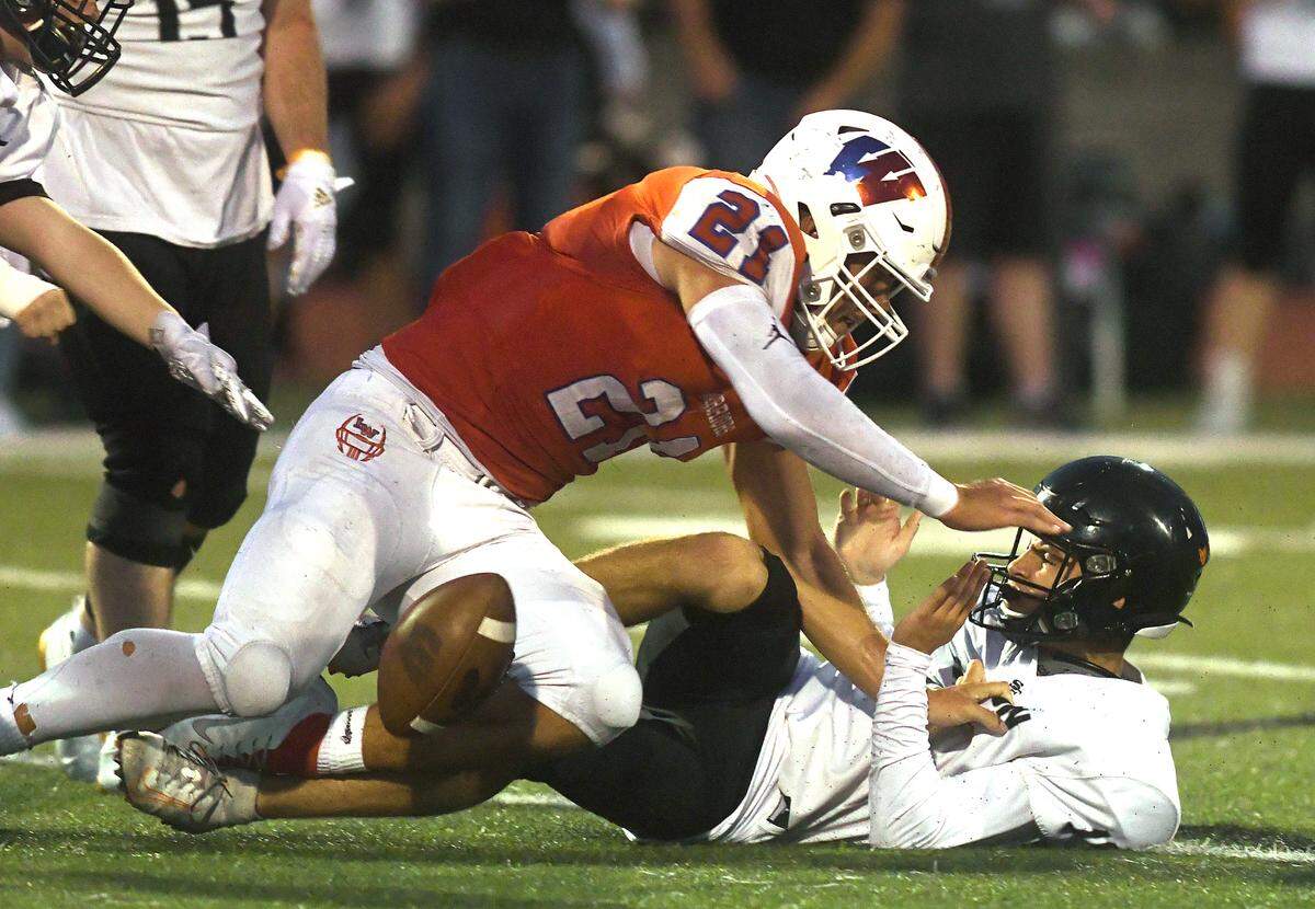 Lebanon’s Keith Brown forces a Silverton fumble.
