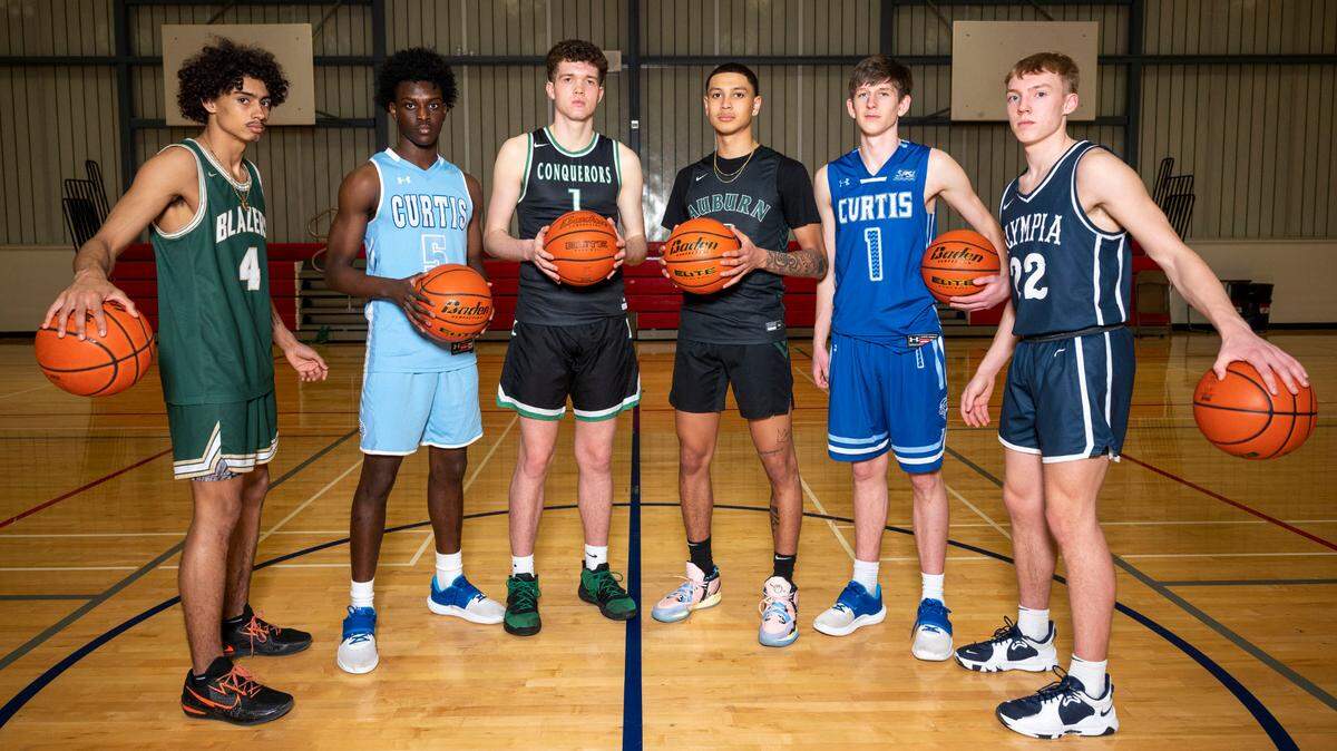 The News Tribune’s 2022 All-Area boys basketball team is pictured at Silas High School in Tacoma, Wash. on Wednesday, March 16, 2022. From left: Brooklyn Hicks, of Timberline; Zoom Diallo, of Curtis,; Logan Stempniak, of Kentwood; Tre Blassingame, of Auburn; Tyce Paulsen, of Curtis; and Parker Gerrits, of Olympia.