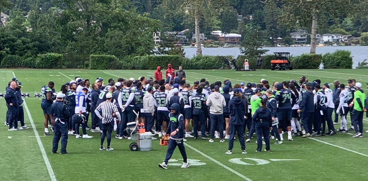 New coach Mike Macdonald gathers his Seahawks around him at the end of the seventh of 10 NFL organized team activities (OTAs) practices at the Virginia Mason Athletic Center along Lake Washington in Renton on June 3, 2024.