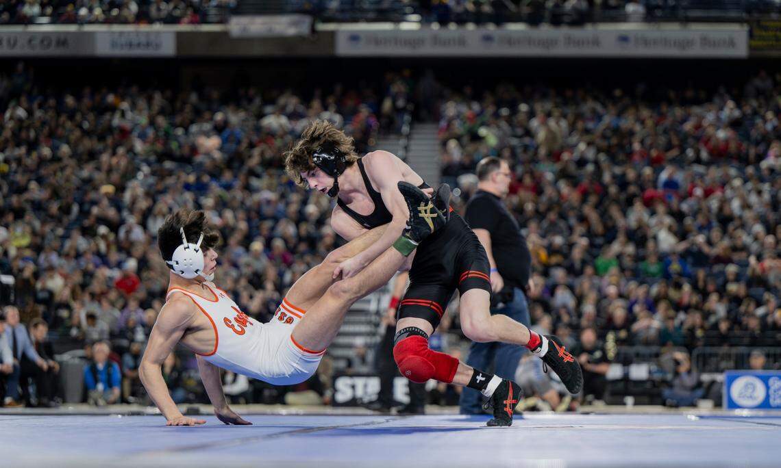 Orting’s Quentin Harding takes down West Valley’s Logan Utecht in the 138-pound 2A championship during day two of the Mat Classic XXXV at the Tacoma Dome on Saturday, Feb. 17, 2024, in Tacoma, Washington.