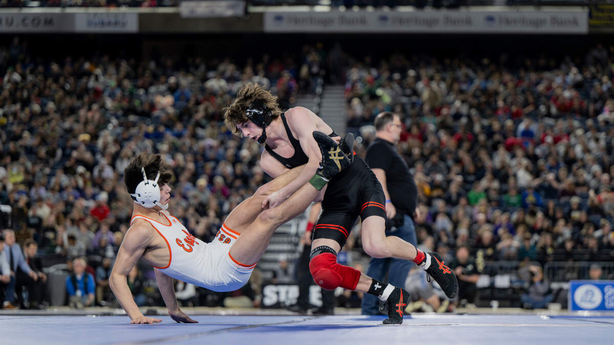 Orting’s Quentin Harding takes down West Valley’s Logan Utecht in the 138-pound 2A championship during day two of the Mat Classic XXXV at the Tacoma Dome on Saturday, Feb. 17, 2024, in Tacoma.