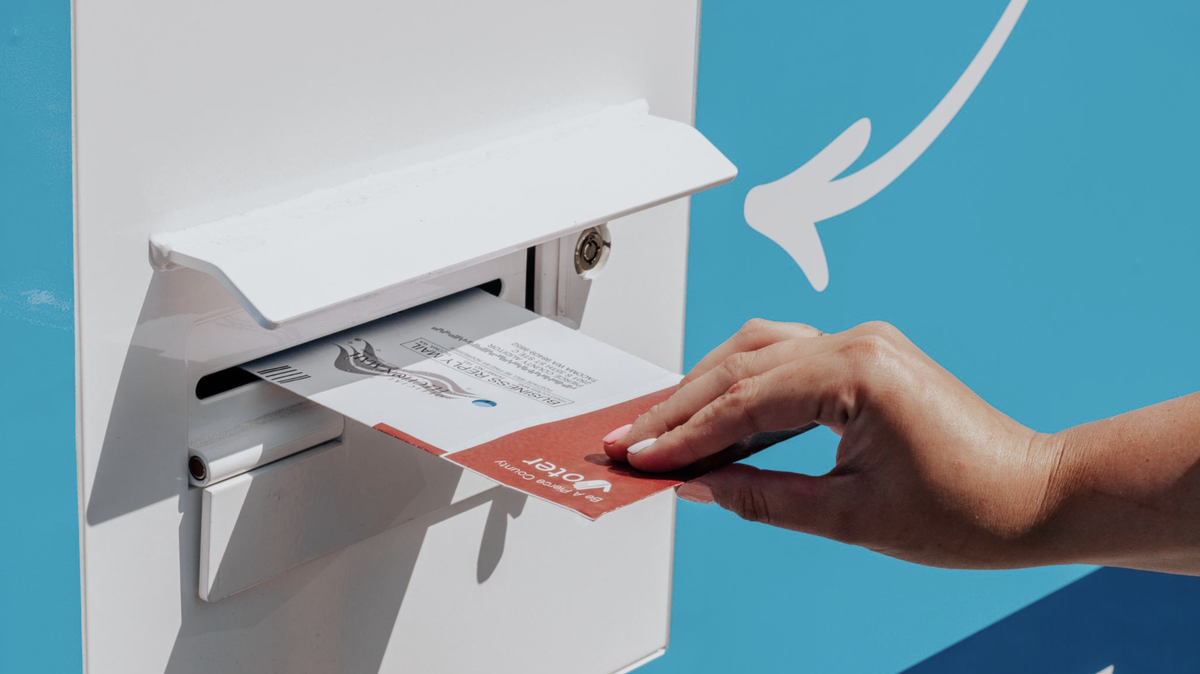 A person drops off their ballot in Pierce County.
