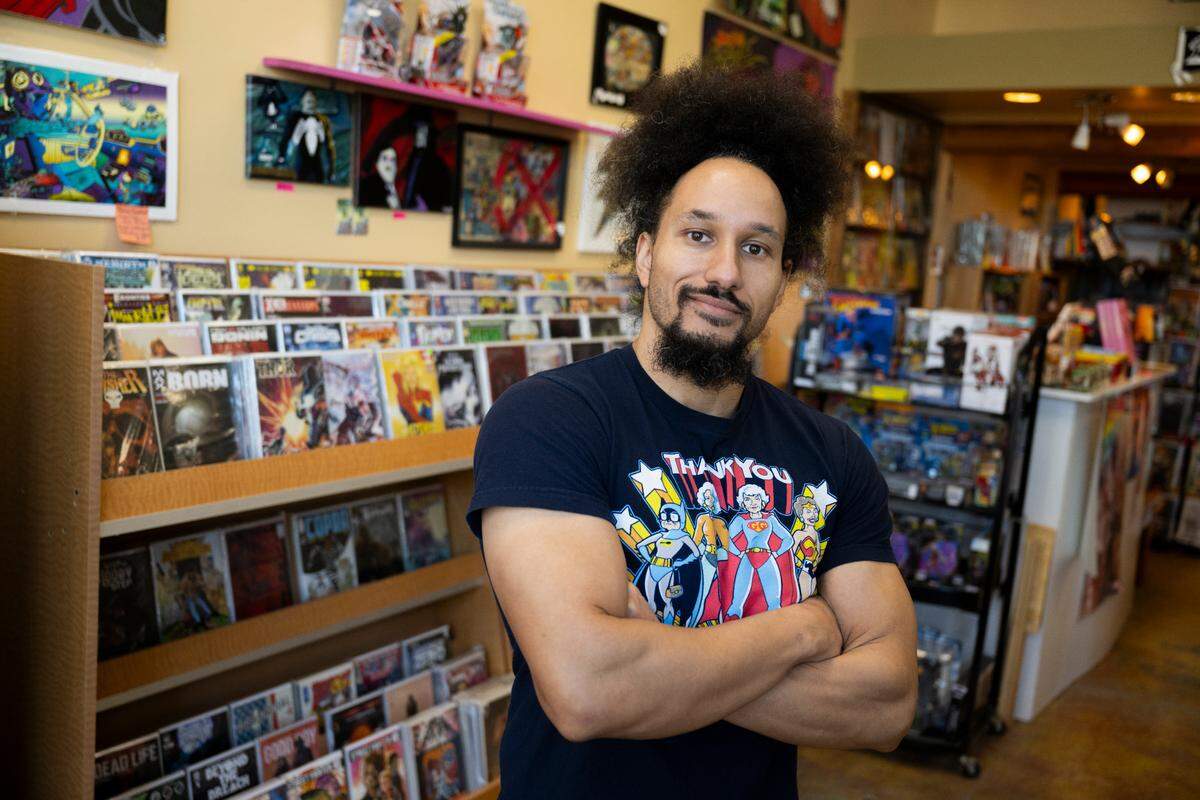 ETHAN H.D., owner and proprietary, Destiny City Comics poses for a portrait, on Wednesday, Feb. 12, 2025, in Tacoma, Wash.