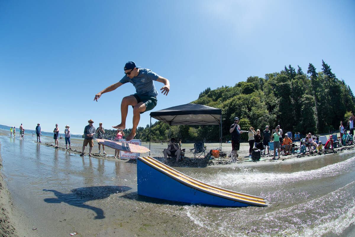 Moments before a big splash at the 2025 Beachfest Skimboarding Competition.