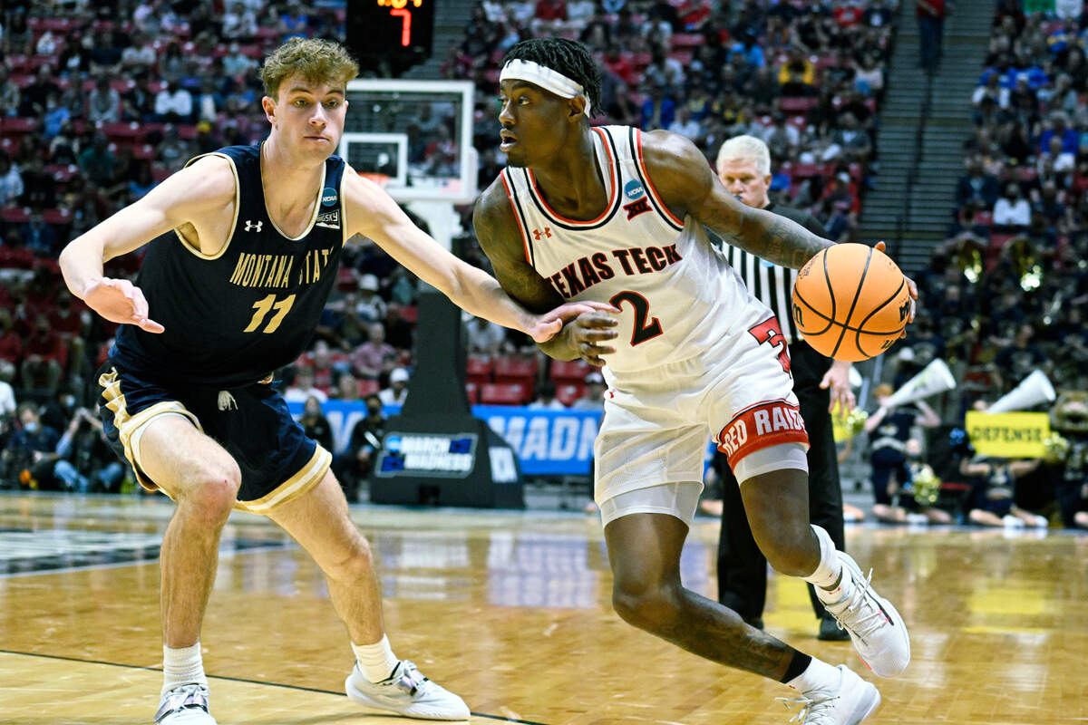 Texas Tech guard Davion Warren (2) drives around Montana State guard Tyler Patterson (11) during the second half of a first-round NCAA college basketball tournament game, Friday, March 18, 2022, in San Diego. (AP Photo/Denis Poroy)