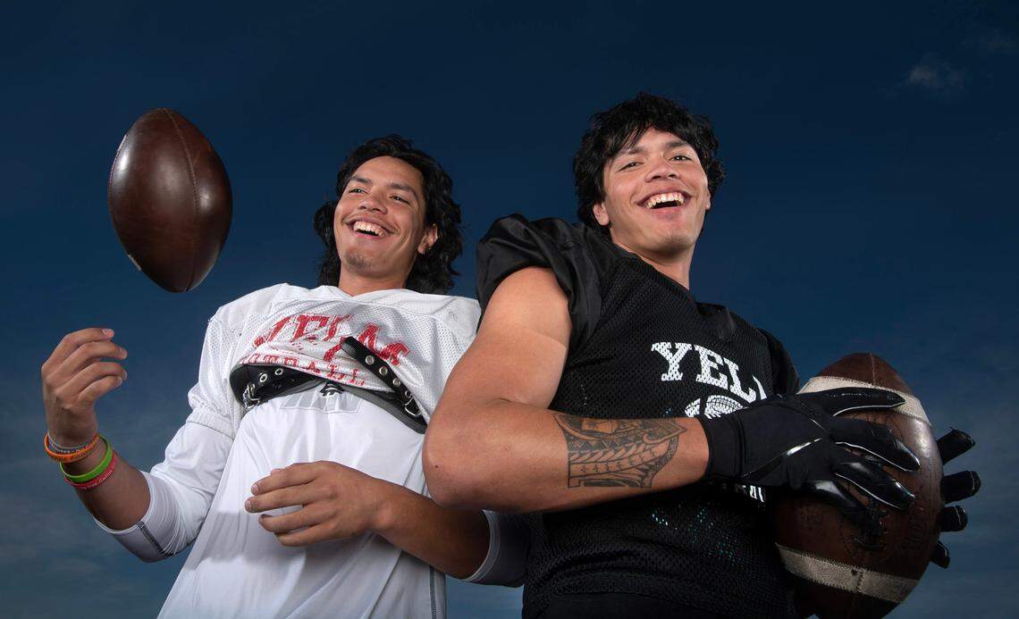With senior Damian Aalona (left) at quarterback and twin brother Marius Aalona at wide receiver, the Yelm Tornados are putting up big offensive numbers with hopes of defending their 2022 state championship. The duo are photographed at Yelm High School on Wednesday, Sept. 13, 2023.