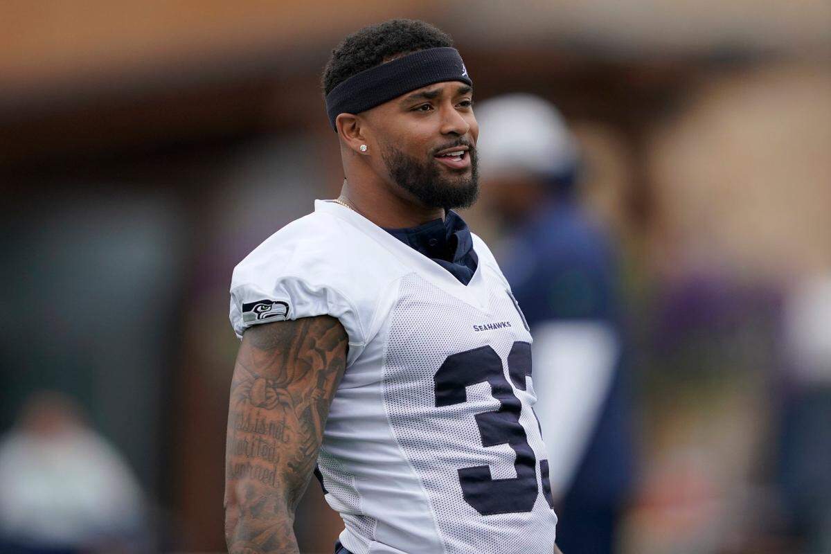 Seattle Seahawks safety Jamal Adams stretches before an NFL football practice, Tuesday, Aug. 17, 2021, in Renton, Wash. The Seahawks signed Adams to a four-year contract extension Tuesday that is expected to make the former All-Pro the highest-paid safety in the NFL. (AP Photo/Ted S. Warren)