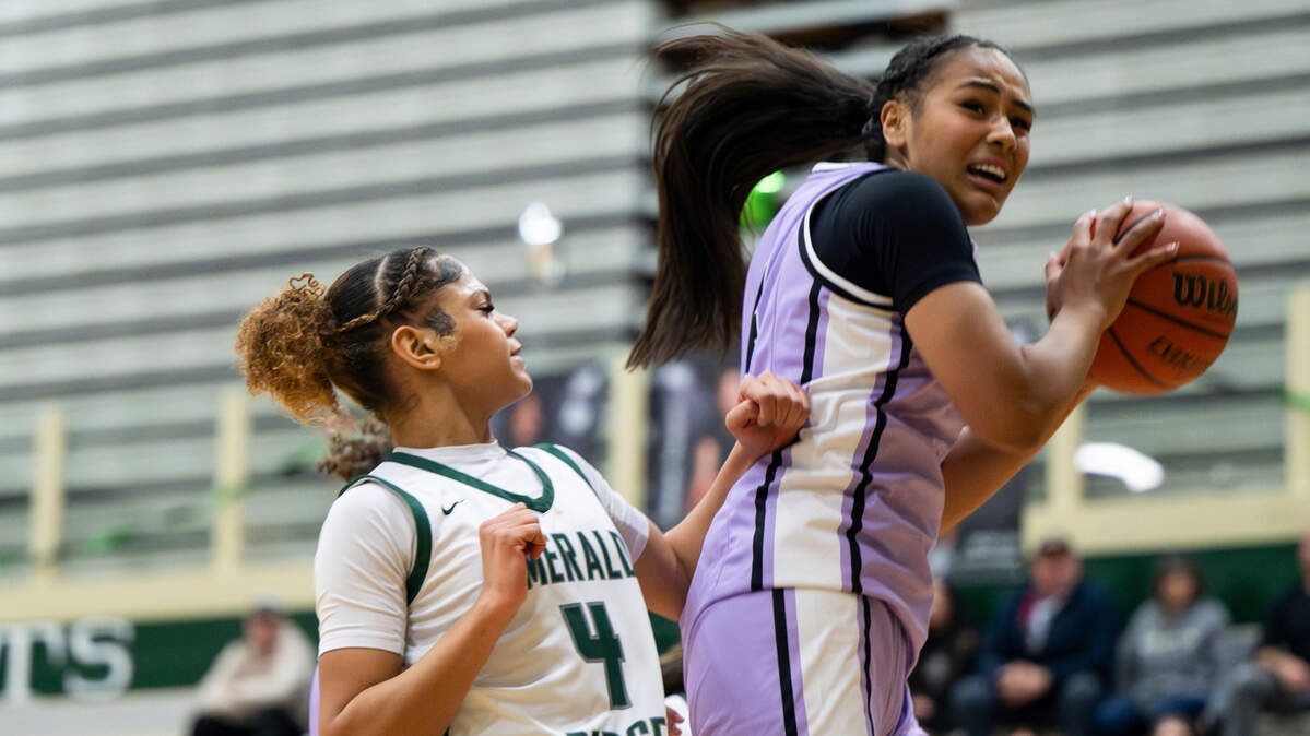 Sumner’s Kawehi Borden (4) snags a offensive rebound against Emerald Ridge’s Naleila Cammack (4) during the second half of of the girls basketball game at Emerald Ridge High School, on Thursday, Jan. 30, 2025, in Puyallup, Wash.