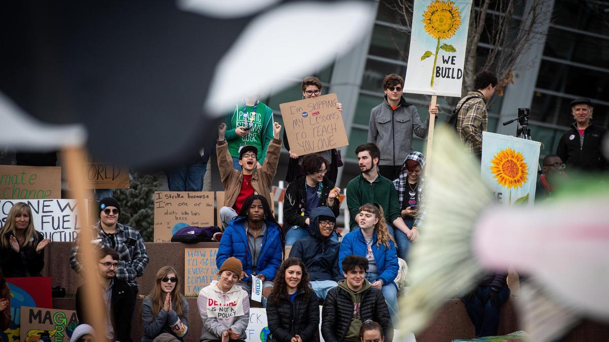 Local students and others listen to speakers during the Youth Climate Strike at Tollefson Plaza in Tacoma, on Friday, Dec. 6, 2019.
