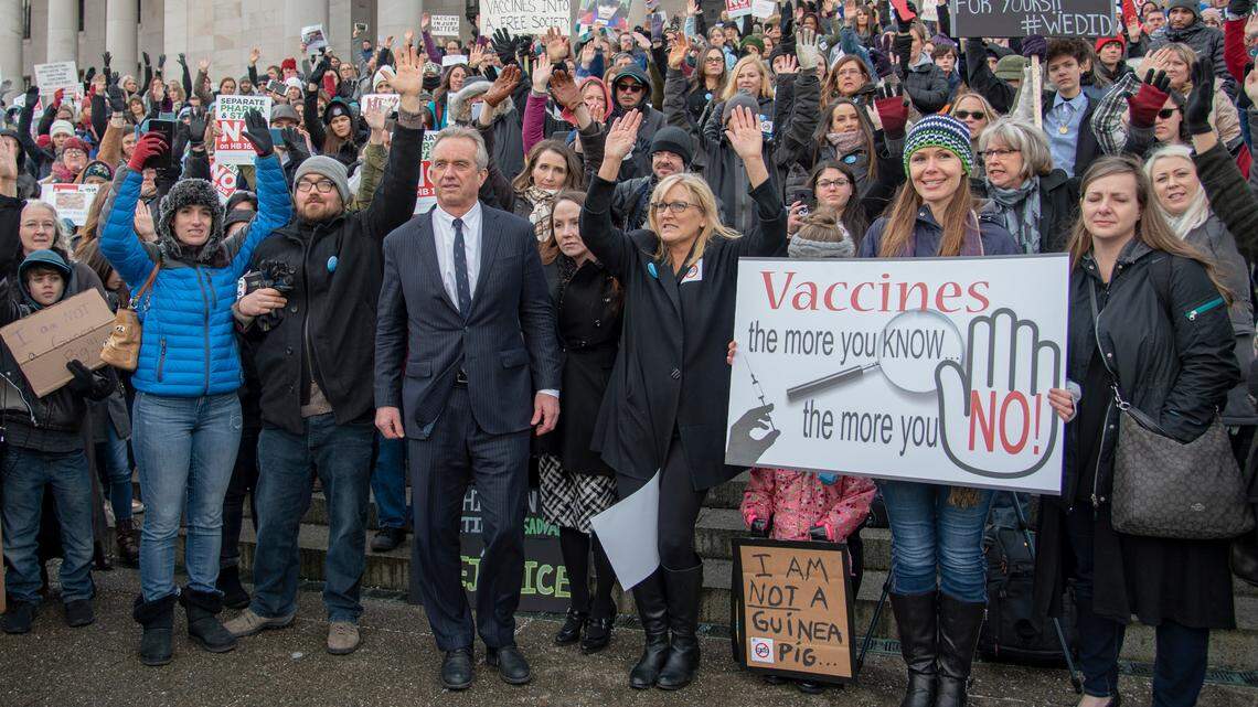 Vaccination critic Robert F. Kennedy Jr., front and center in suit, was at the state Capitol in Olympia on Friday to oppose a bill that would restrict exemptions for mandatory vaccinations.