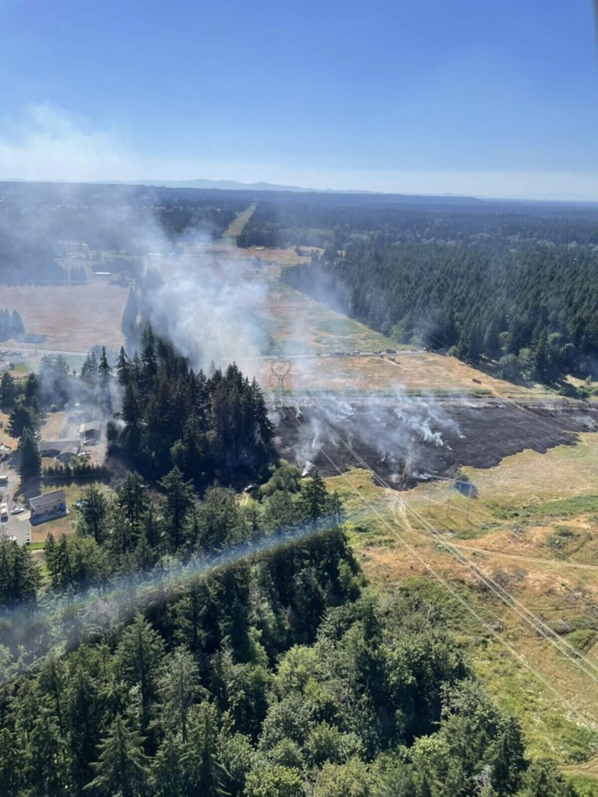 Crews responded to a large brush fire July 9, 2024 on state Route 507 south of Roy.