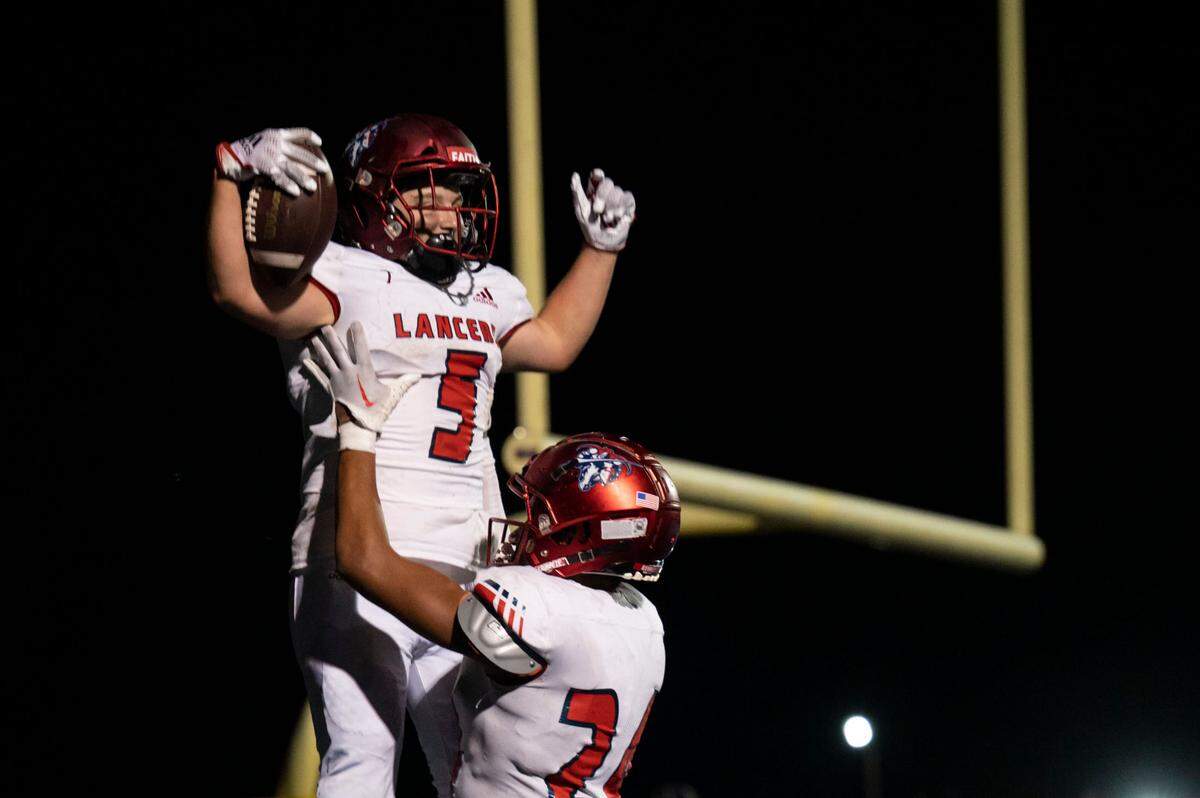 Kennedy Catholic running back Indy Jones celebrates with Xe’Ree Alexander after Jones scored a touchdown in the fourth quarter of a 4A NPSL game against Federal Way on Friday, Sept. 30, 2022, at Federal Way Memorial Field in Federal Way, Wash.