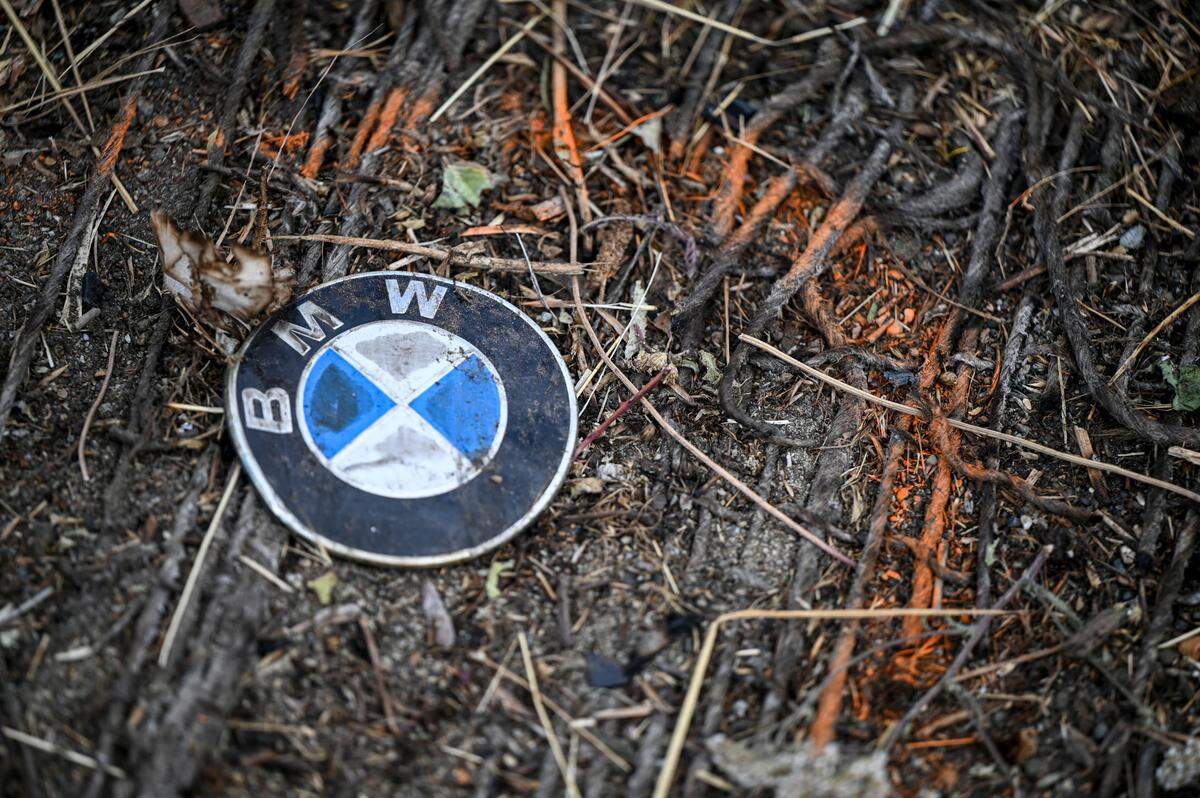 Debris and evidence markings are seen at the scene of a car crash at state Route 509 and Alexander Avenue East that left six dead and three injured on July 16 in Tacoma.