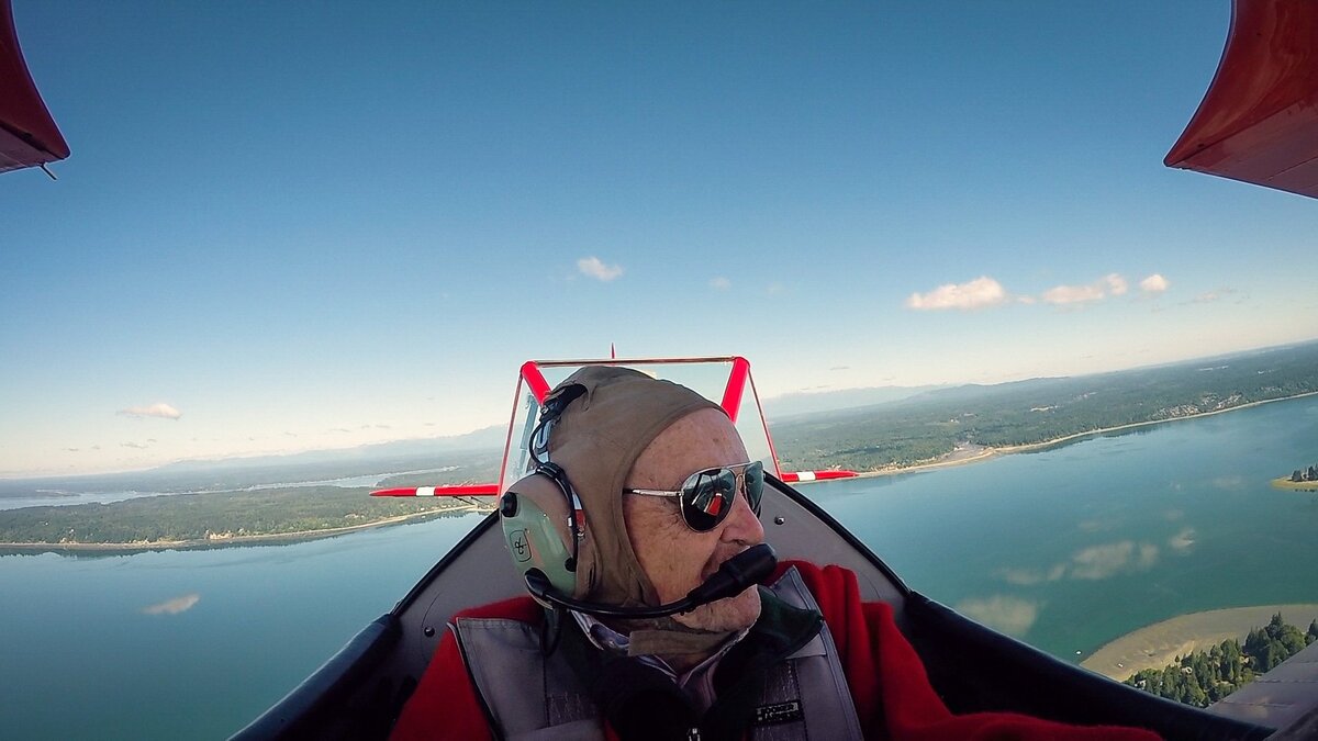 Ed Hughes, a World War II Navy veteran, looks out from the cockpit during his Ageless Aviation flight July 11 at the Tacoma Narrows Airport in Gig Harbor.