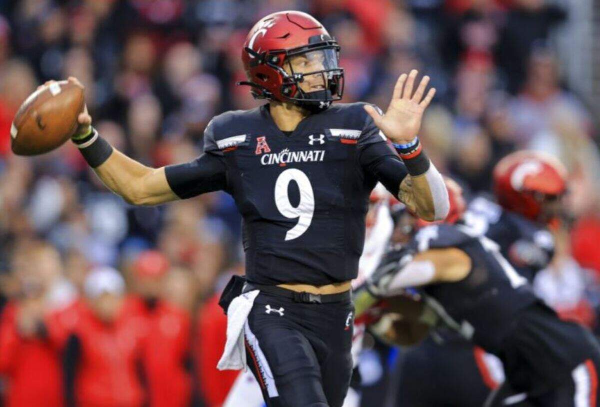 Former University of Cincinnati quarterback Desmond Ridder throws a pass during the first half of the team’s NCAA college football game against SMU on Nov. 20, 2021, in Cincinnati. He reportedly had a pre-draft visit with the Seahawks.