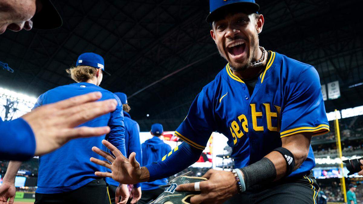Seattle Mariners outfielder Julio Rodríguez (44) greets teammates before the game against the Texas Rangers at T-Mobile Park, on Friday, June 14, 2024, in Seattle, Wash.