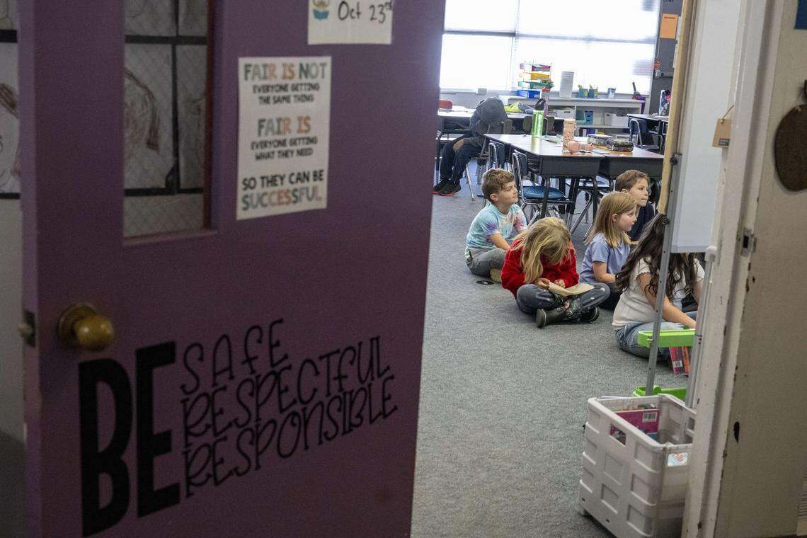 Students listen to a story in an annex building that is being used for classrooms at Orting Elementary School on Wednesday, Oct. 15, 2025, in Orting, Wash.