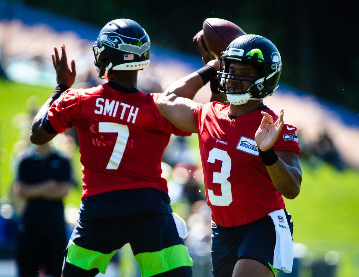 Russell Wilson and Geno Smith do throwing drills at the Seattle Seahawks training camp at the Virginia Mason Athletic Center in Renton, Wash., on Thursday, July 25, 2019.