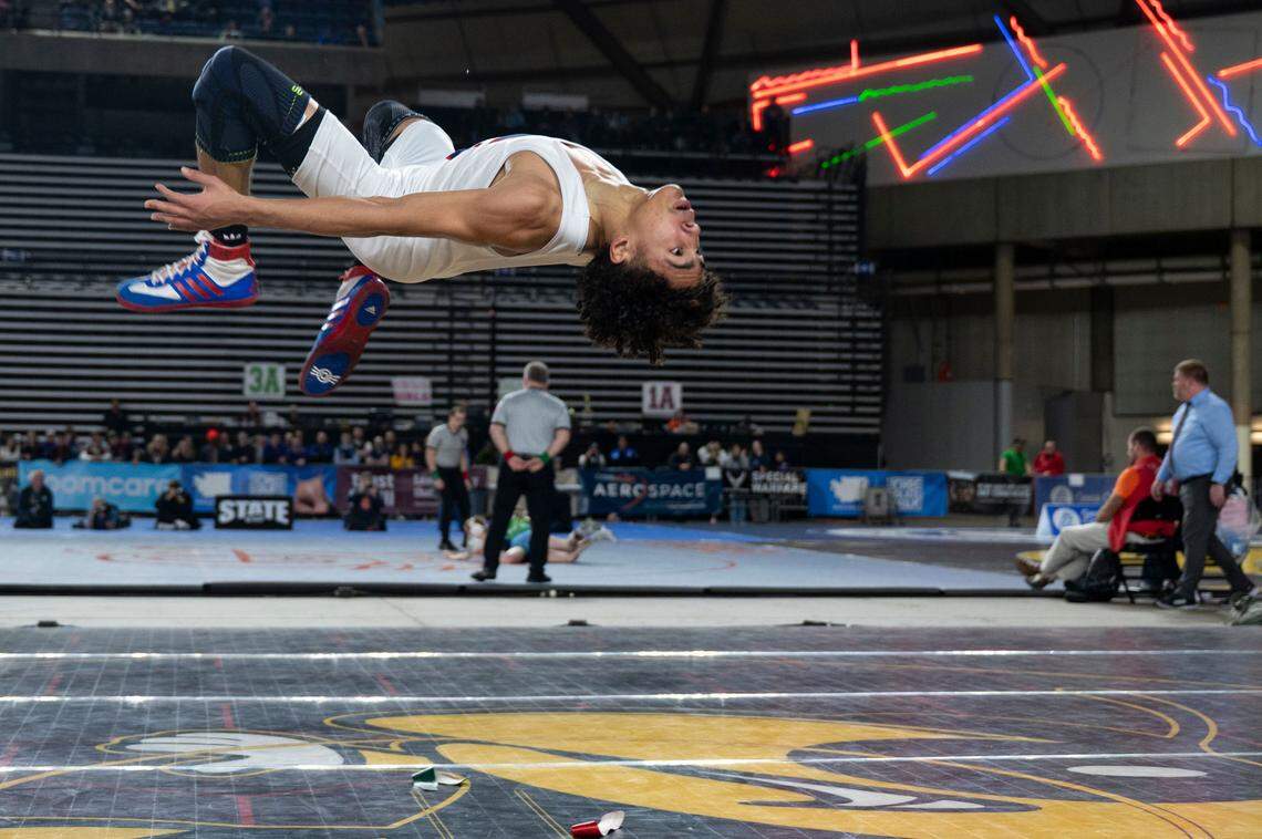 Silas’ Adrian Windsor performs a celebratory flip after beating Kennewick’s Abraham Noriega to win the Class 3A 113-pound championship on Friday, Feb. 21, 2025, at Mat Classic XXXVI at the Tacoma Dome in Tacoma, Wash.
