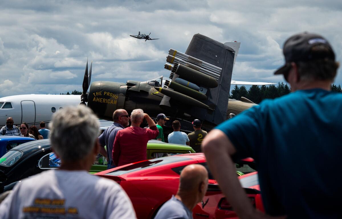 People take in the Wings & Wheels show at the Tacoma Narrows Airport in Gig Harbor on Saturday, July 6, 2019.