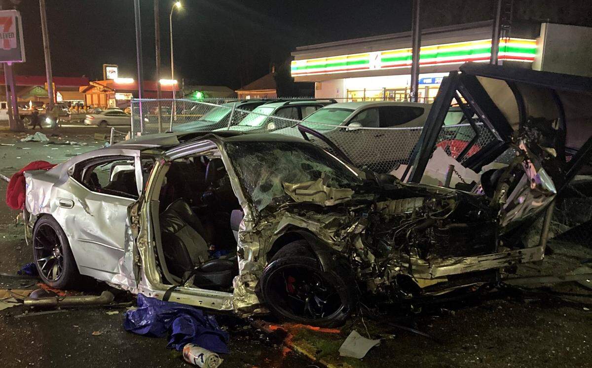 A 47-year-old woman was killed Wednesday night at an intersection near Parkland and three other people injured in a collision caused by a man fleeing from Pierce County Sheriff’s Department deputies.