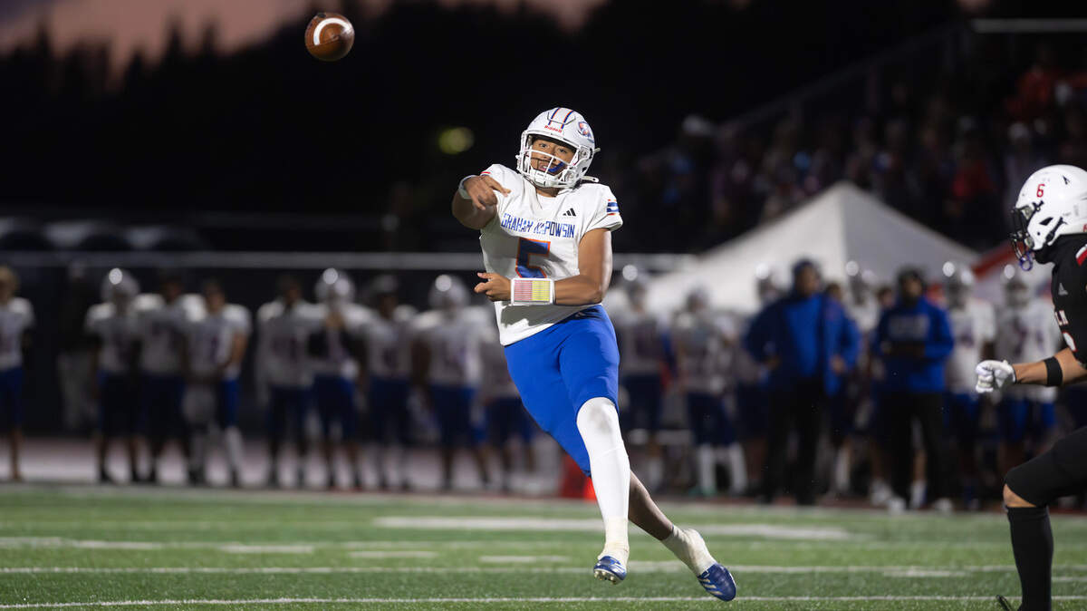 Graham Kapowsin quarterback AJ Tuivaiave delivers a pass during Friday night’s football game against the Yelm Tornados at Yelm High School in Yelm, Washington, on Oct. 4, 2024.