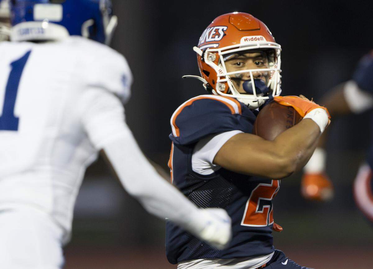 Lakes running back Toetu Moliga-Taiepisi (22) carries the ball against the Curtis Vikings during the first half of the game at Harry Lang Stadium, on Friday, Sept. 19, 2025, in Lakewood, Wash.