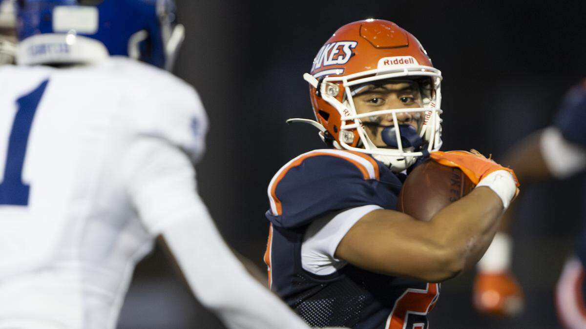 Lakes running back Toetu Moliga-Taiepisi (22) carries the ball against the Curtis Vikings during the first half of the game at Harry Lang Stadium, on Friday, Sept. 19, 2025, in Lakewood, Wash.