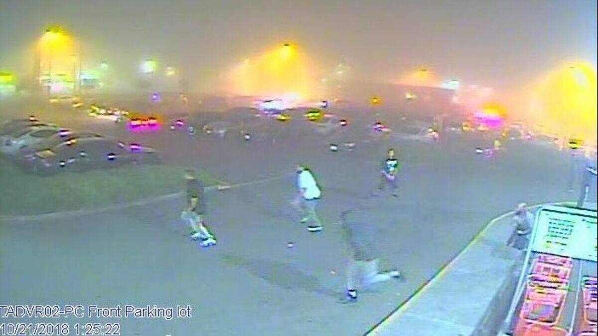 Three people are seen running from the New World VIP Lounge in Lakewood after an early morning shooting Sunday that killed one and injured three.