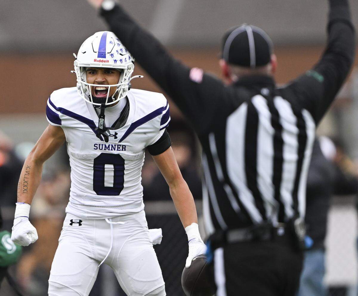 Sumner wide receiver Braylan Pope (0) reacts to a touchdown against Puyallup during the first half of the 4A state semifinal game at Sparks Stadium, on Saturday, Nov. 29, 2025 in Puyallup, Wash.
