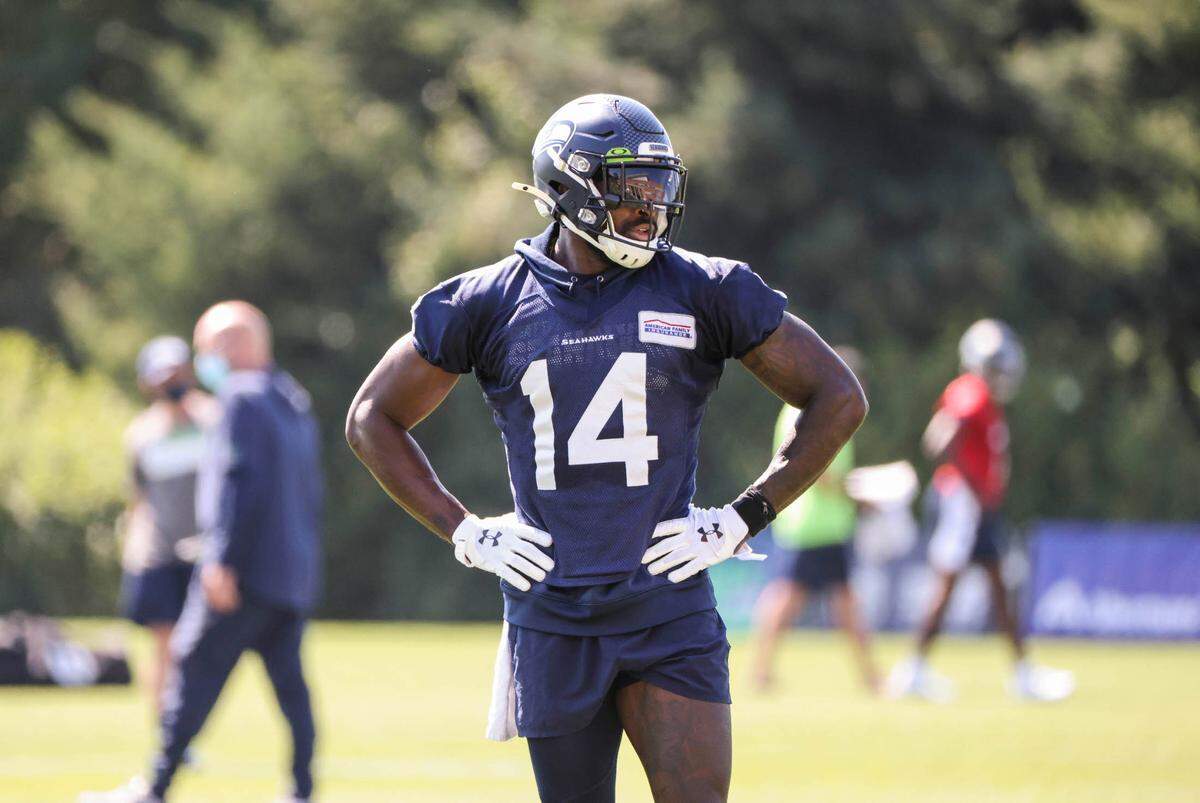 DK Metcalf gets extra reps in with Russell Wilson following Thursday’s practice. The Seattle Seahawks practiced Thursday, August 13, 2020 at the VMAC in Renton, WA.