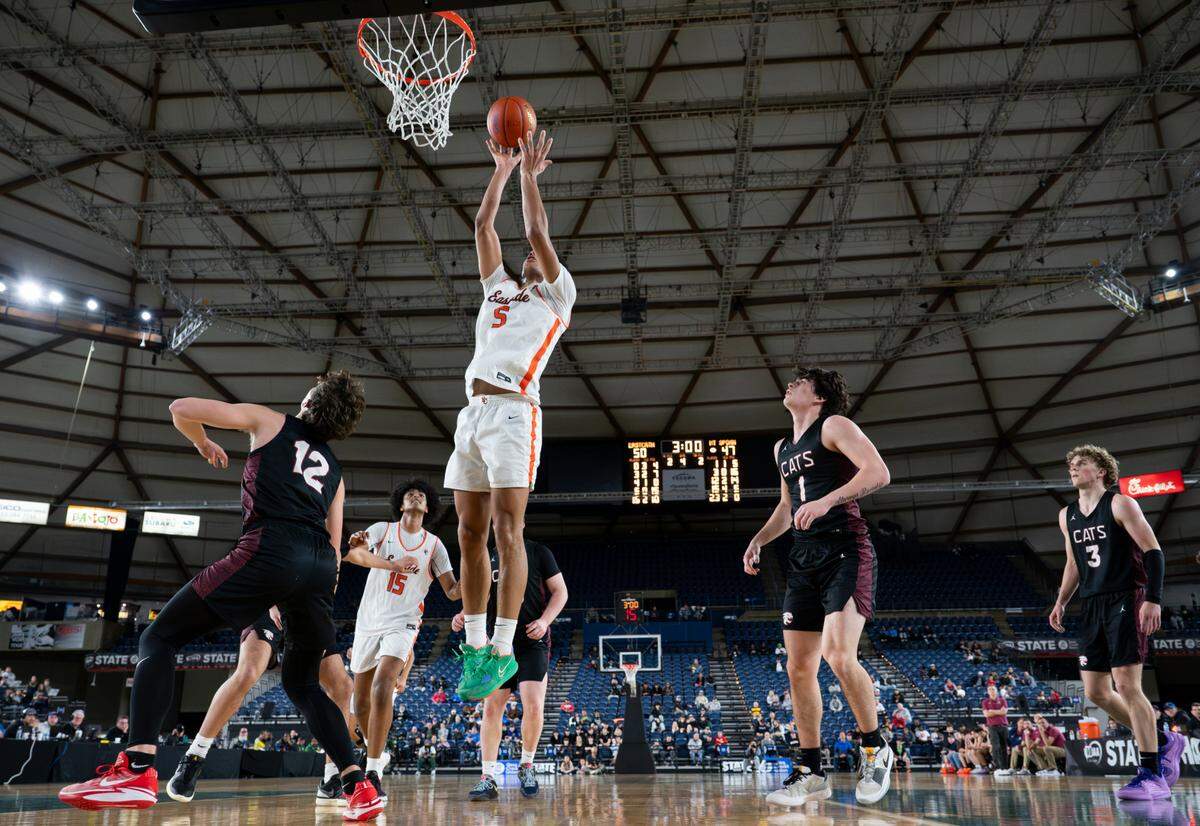 Eastside Catholic’s Jacob Cofie (5) gets the third-chance bucket against Mt. Spokanes during the semifinals game of the Class 3A state tournament at the Tacoma Dome, on Friday, March 1, 2024, in Tacoma, Wash.
