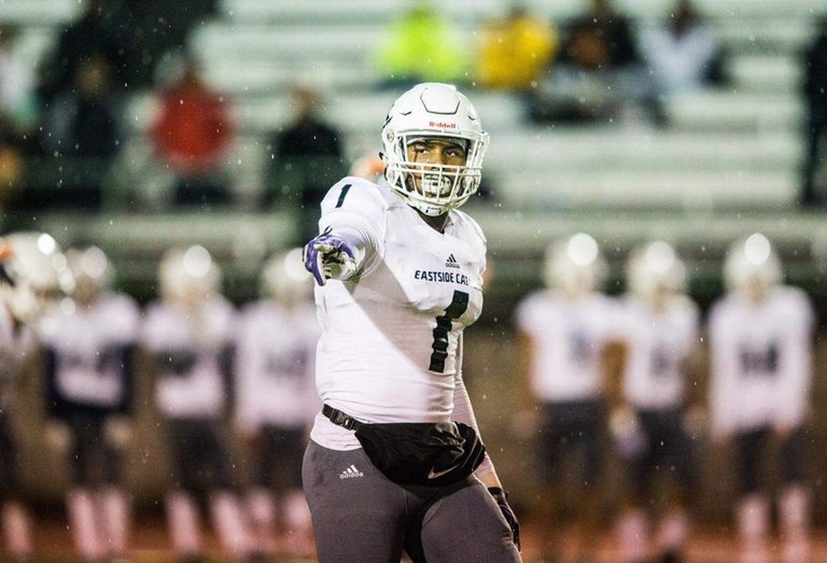 Eastside Catholic High Schools’s D.J. Rogers points to O’Dea teammates before a play as the Crusaders take on the Fighting Irish at West Seattle Stadium on Friday, Oct. 5, 2019.